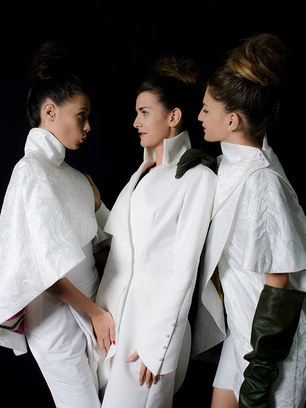 three beautiful models in white dresses